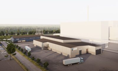 Konceptbild över demonstrationsanläggning för kritiska mineral, med tillhörande blå kontorsbyggnad, vita byggnader representerar den planerade framtida industriparken i Luleå.